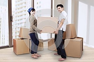 Young couple moving in new home