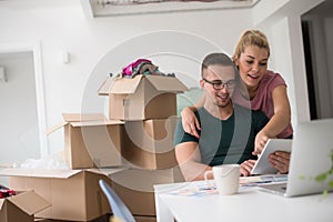 Young couple moving in a new home