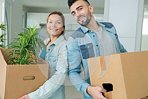 Young couple moving to new apartment together relocation