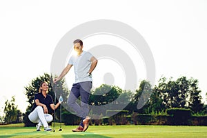 Young couple at golf court