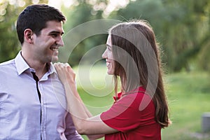 Young couple out on a date in the park during summer