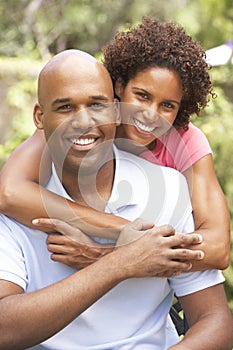 Young Couple Outdoors Hugging