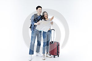 Young couple packing for vacation travel on isolated. Young Asian man and women are preparing for the journey happily on white