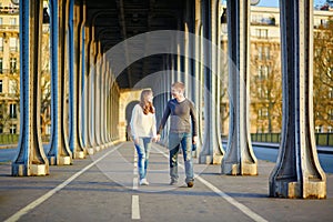 Young couple in Paris on the Bir Hakeim bridge
