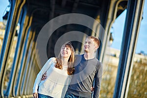 Young couple in Paris on the Bir Hakeim bridge