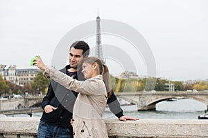 Young couple in Paris making selfie