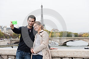 Young couple in Paris making selfie