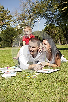 Young couple in park with child