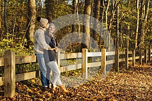 Young couple in the park at sunny autumn day