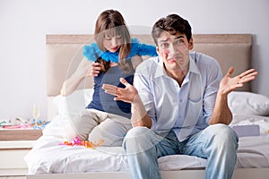 The young couple partying in the bed