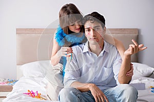 The young couple partying in the bed