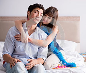 Young couple partying in the bed