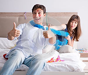 Young couple partying in the bed