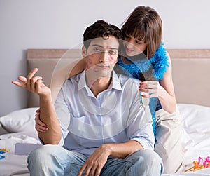 Young couple partying in the bed