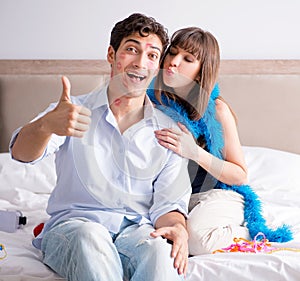 Young couple partying in the bed