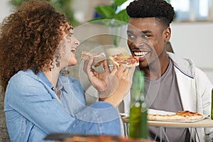 young couple with pizza at home