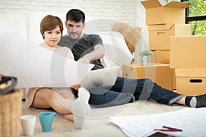 Young couple planning their new house.