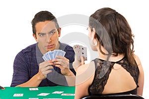 Young couple playing cards cuarenta