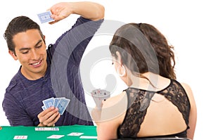 Young couple playing cards cuarenta