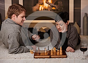 Young couple playing chess