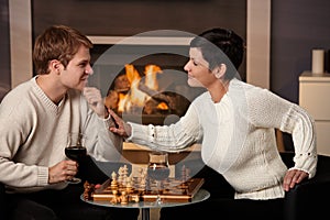 Young couple playing chess