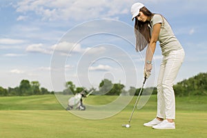 Young couple playing golf