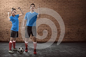 Young couple playing street soccer