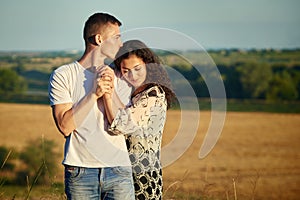 Young couple portrait on country outdoor, love and tenderness concept, summer season