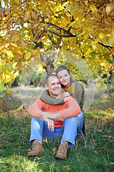Young couple portraits, rest outdoor in autumn park, family relax, love couple