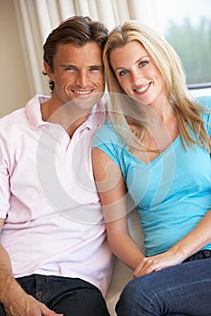 Young couple posing indoors photo