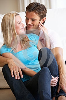 Young couple posing indoors photo