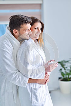 Young couple posing in their kitchen