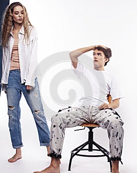 Young couple posing on white background isolated, fighting, arguing, unhappy people concept
