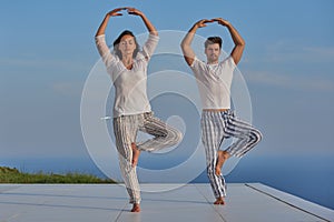 Young couple practicing yoga