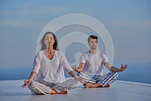 Young couple practicing yoga