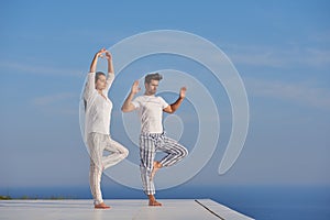 Young couple practicing yoga