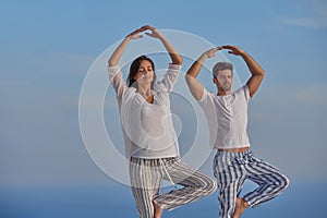 Young couple practicing yoga