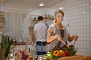 Young couple prepares cooking a breakfast in kitchen