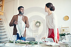 Young Couple Preparing for Christmas Banquet