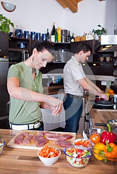 Young couple preparing lunch