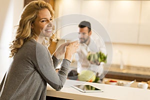 Young couple preparing meal in the kitchen