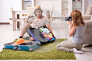 Young couple preparing for trip