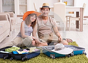 Young couple preparing for trip