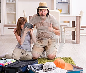 Young couple preparing for trip