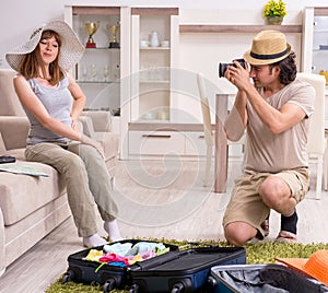 Young couple preparing for trip