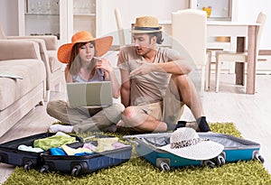 Young couple preparing for trip