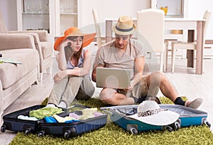 Young couple preparing for trip