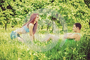 Young couple press up on nature instagram stile