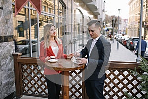 Young couple of professionals chatting during a coffee break