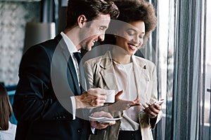 Young couple of professionals chatting during a coffee break